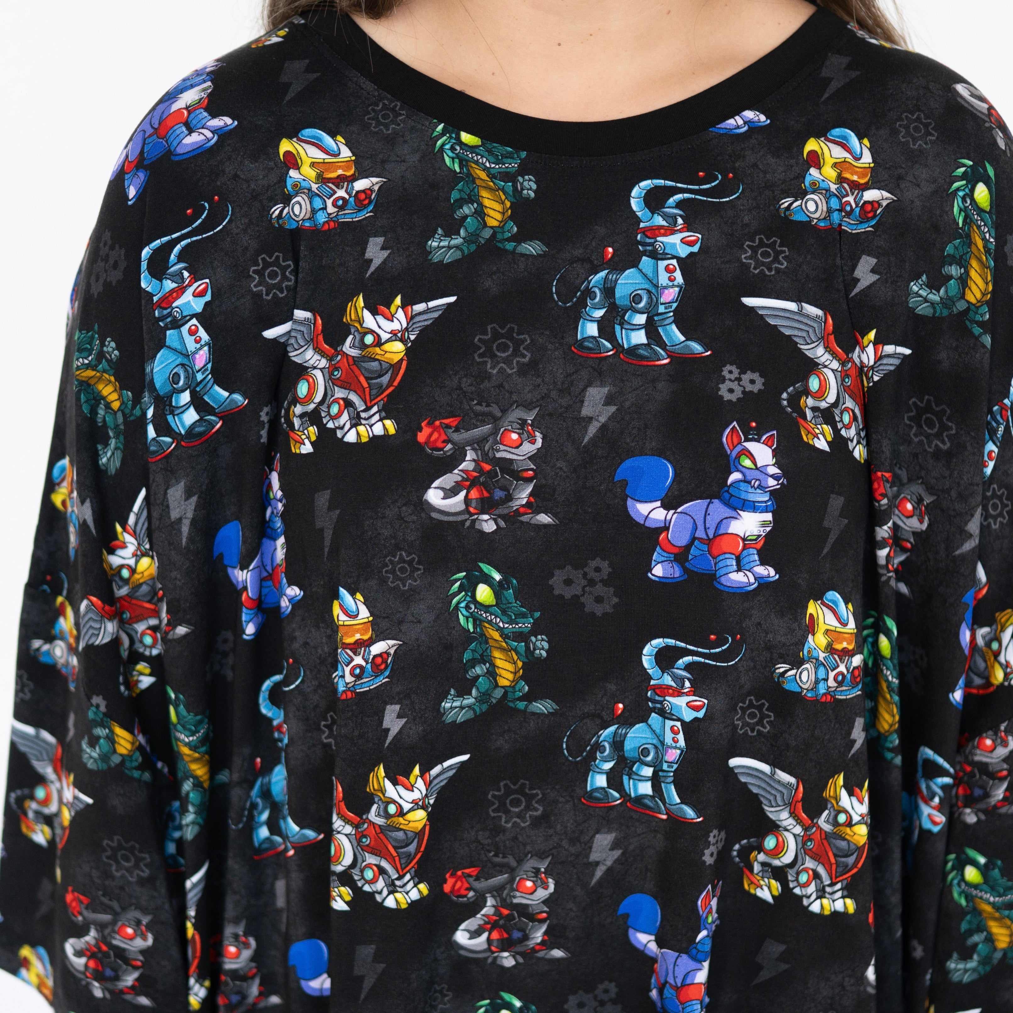 Black sleep tee with a repeating pattern of colorful robot characters.