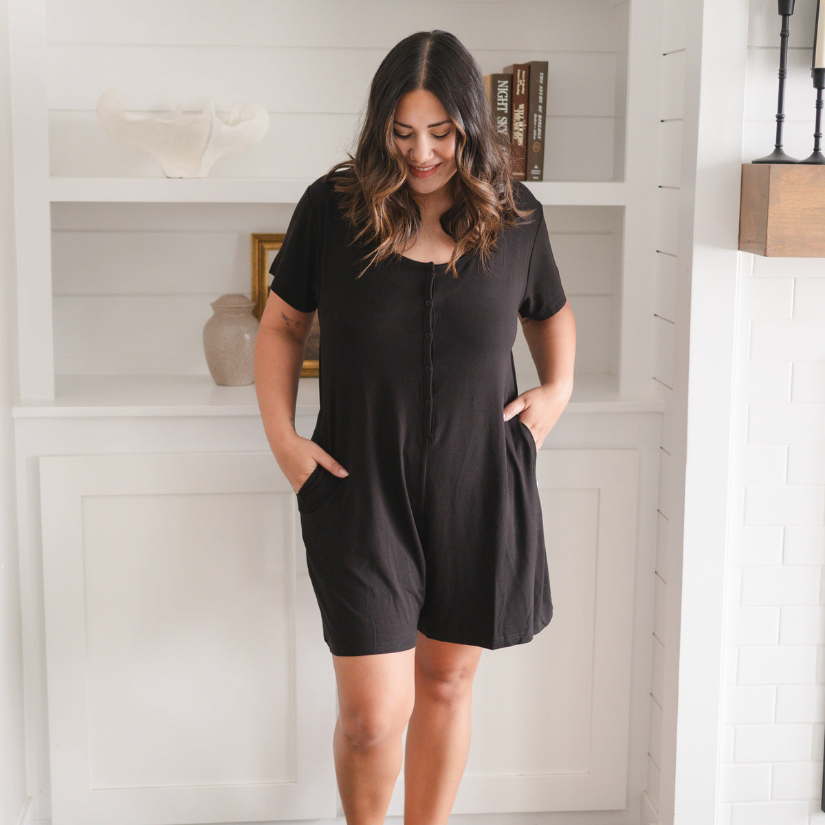 Adult shorty romper in obsidian luxe bamboo with chest snaps.