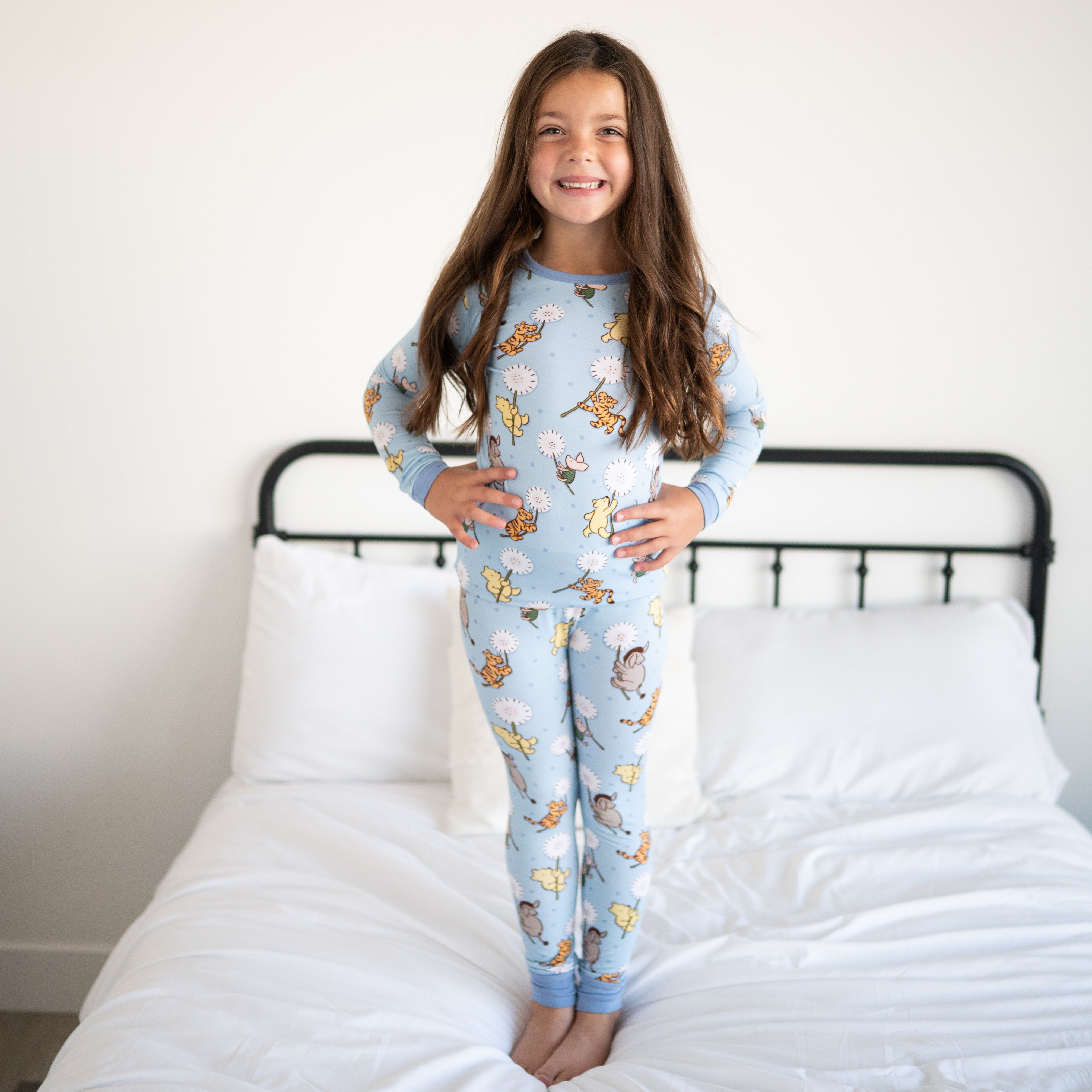 A young girl in light blue pajamas