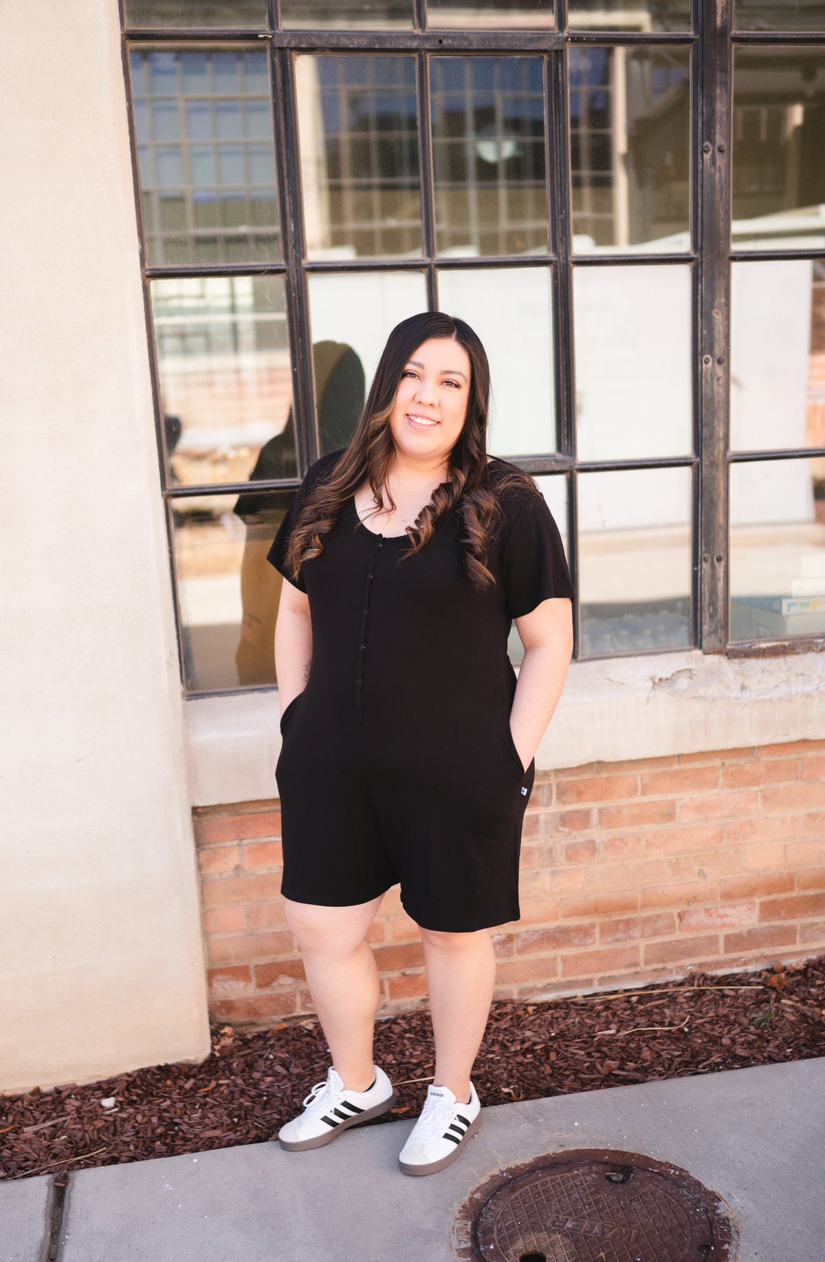 Adult shorty romper in obsidian luxe bamboo with chest snaps.