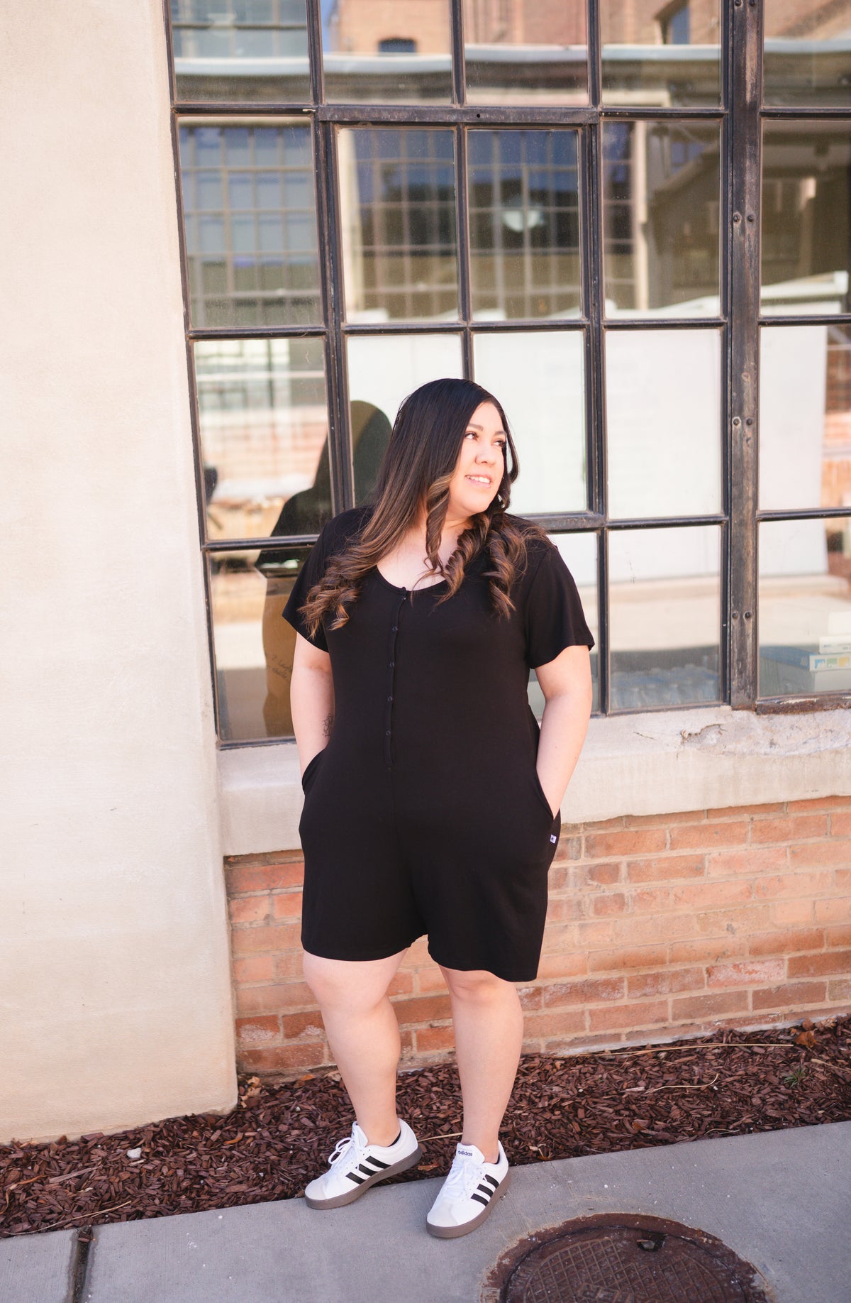 Adult shorty romper in obsidian luxe bamboo with chest snaps.
