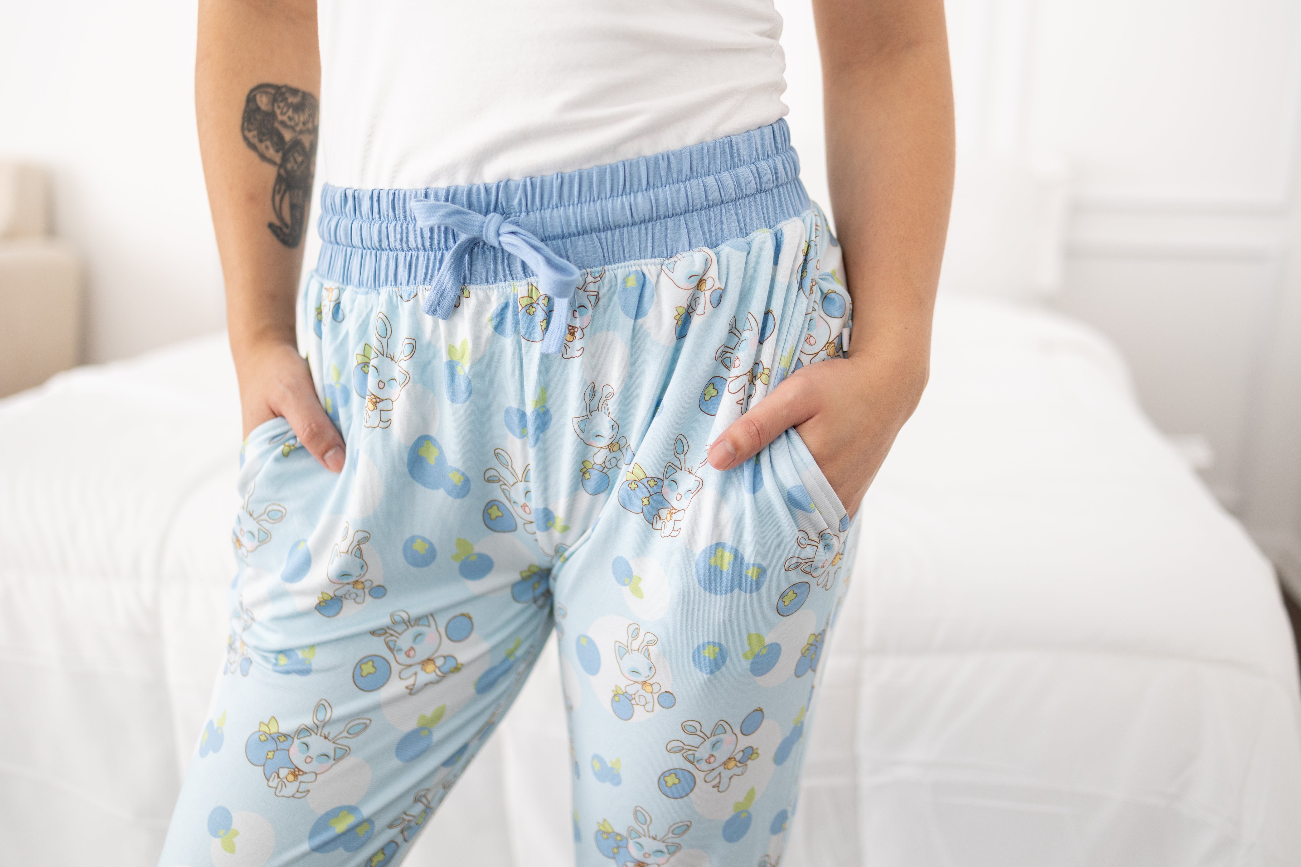 Women's light blue joggers with a blueberry and baby Neopets print.