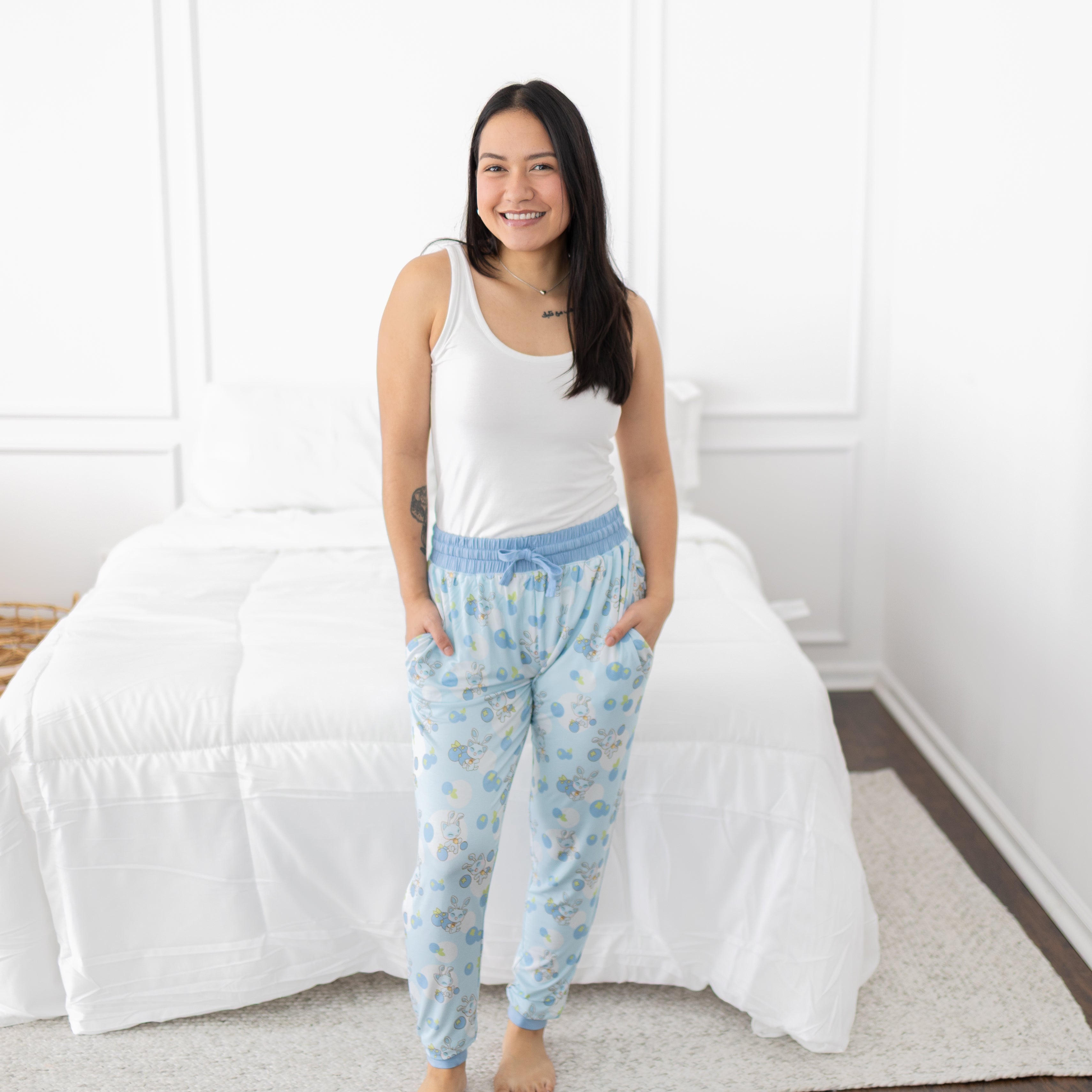 Women's light blue joggers with a Neopets blueberry baby print.