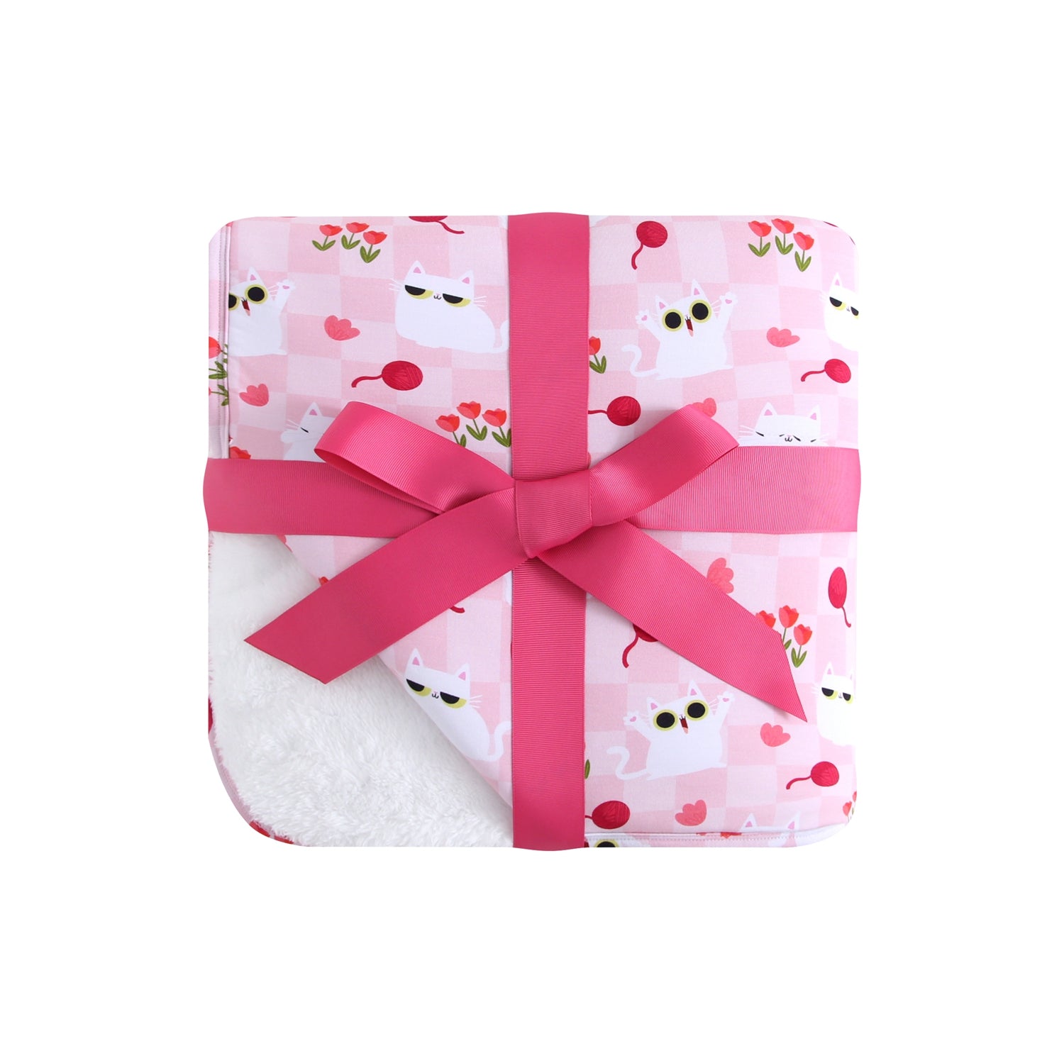 A pink blanket with a checkered pattern featuring white cats, red cherries, and flowers, tied with a pink ribbon.