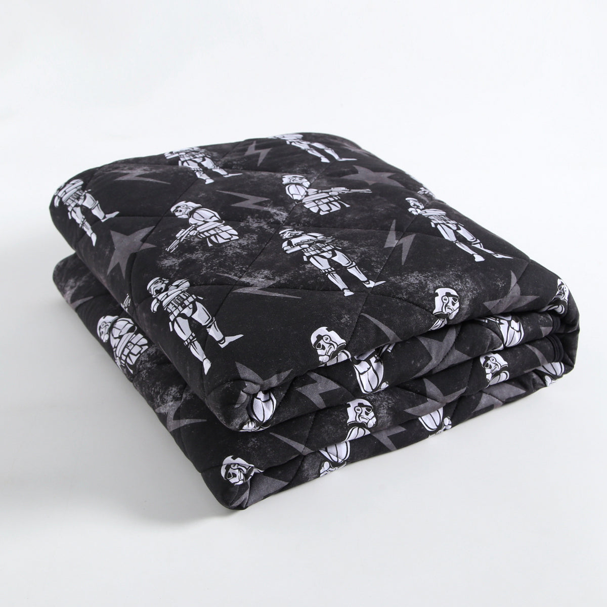 A black quilted blanket with a repeating pattern of white stormtroopers and lightning bolts.