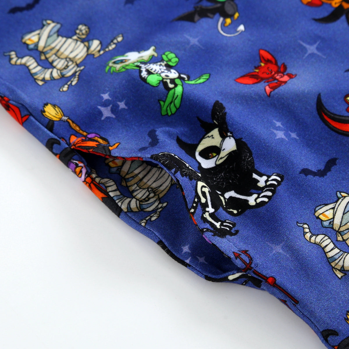 Blue fabric with a Halloween print of Neopets characters.