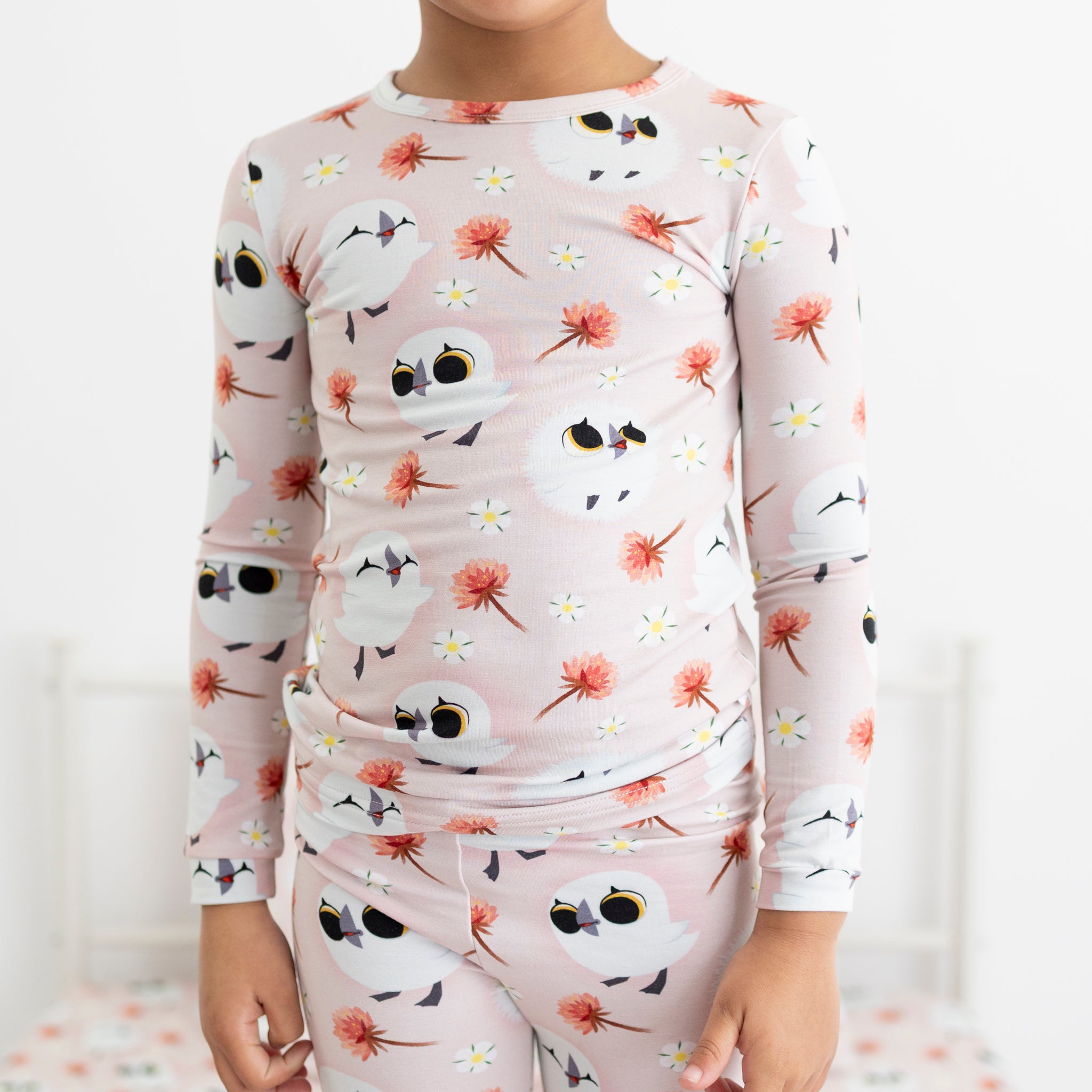 Pink long sleeve pajama set with a Puffin Rock™ print.