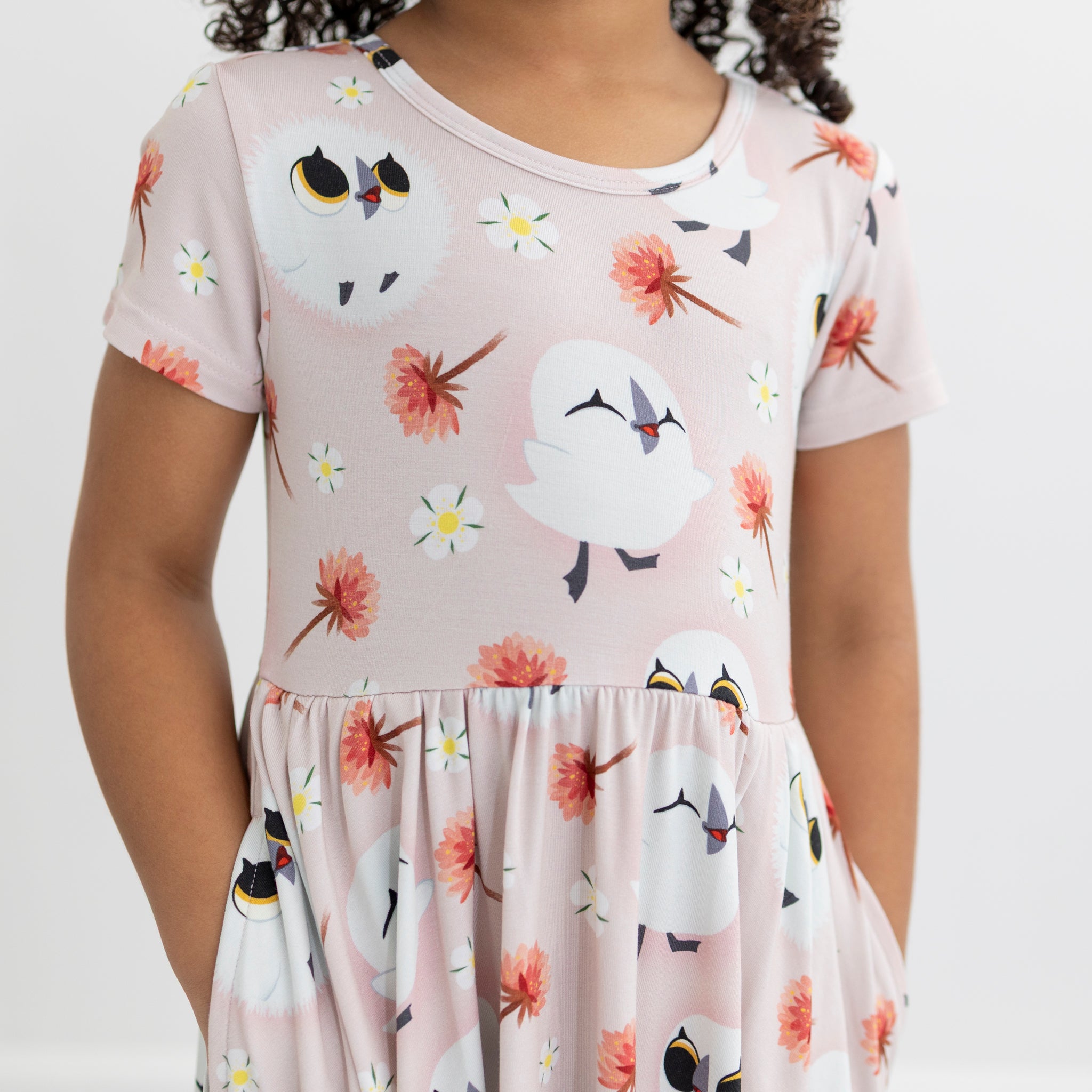 Pink Tencel Modal dress with Puffin Rock print and pockets.