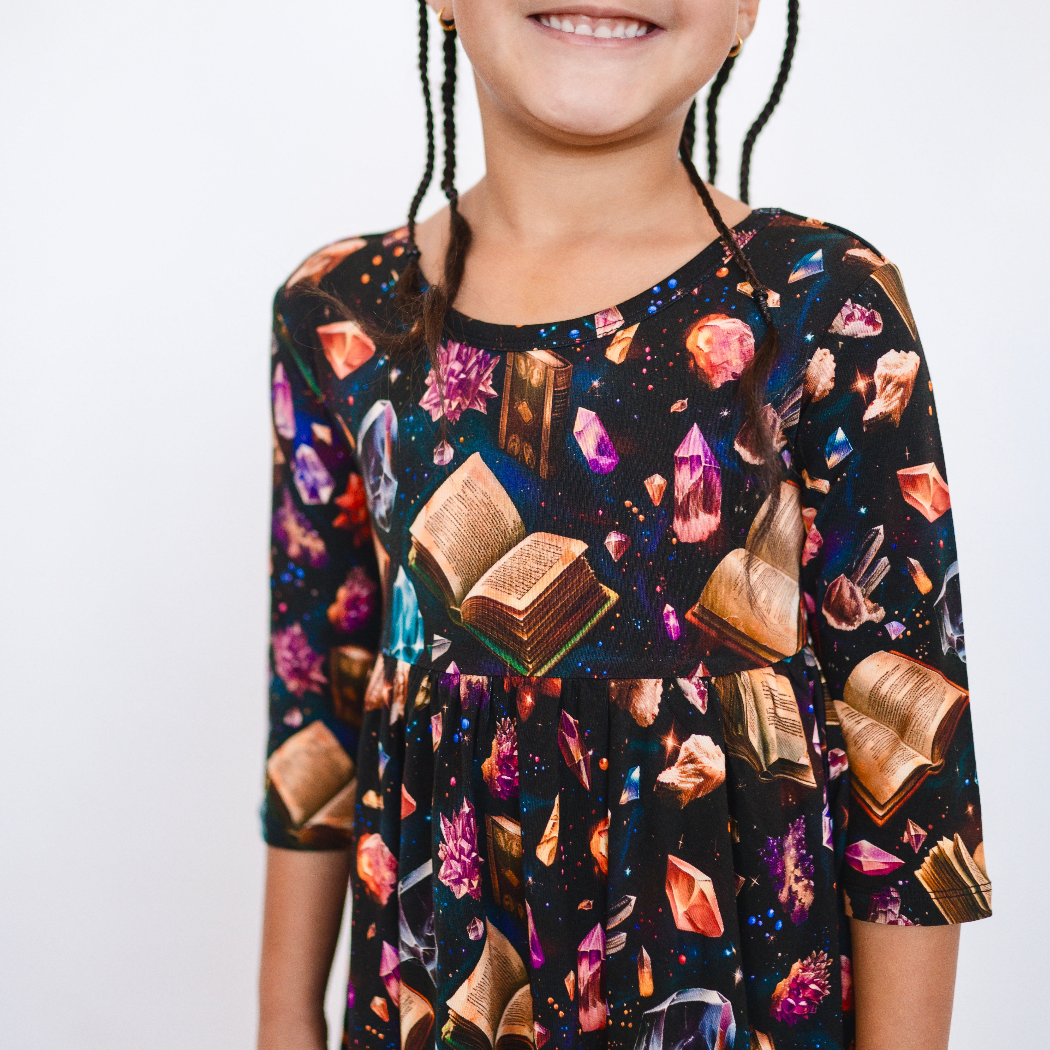 3/4 sleeve black dress with crystal and book print.