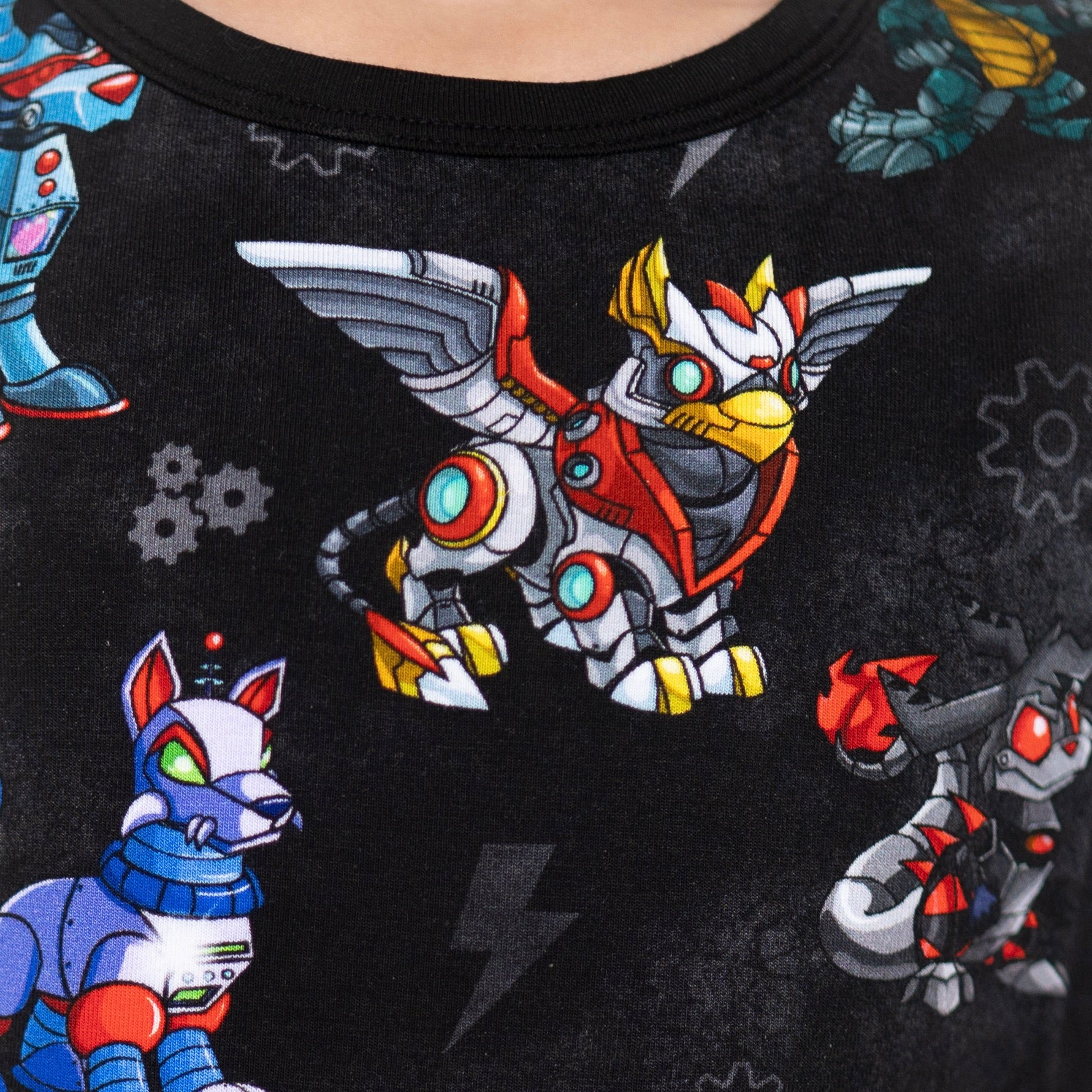 T-shirt with a black background featuring colorful robot characters.