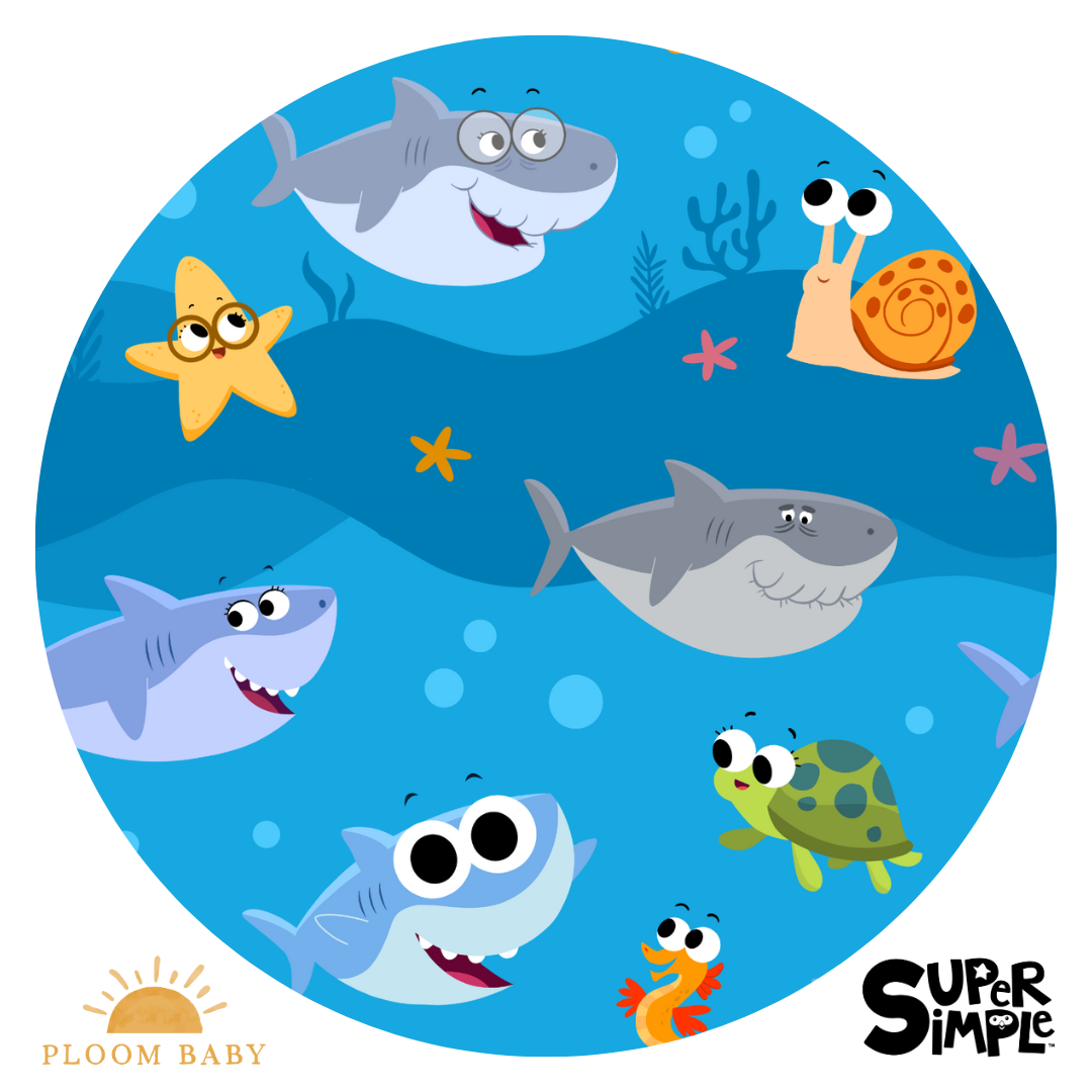 A circular illustration of cartoon sharks, a starfish, a snail, a turtle, and a seahorse swimming in blue water.