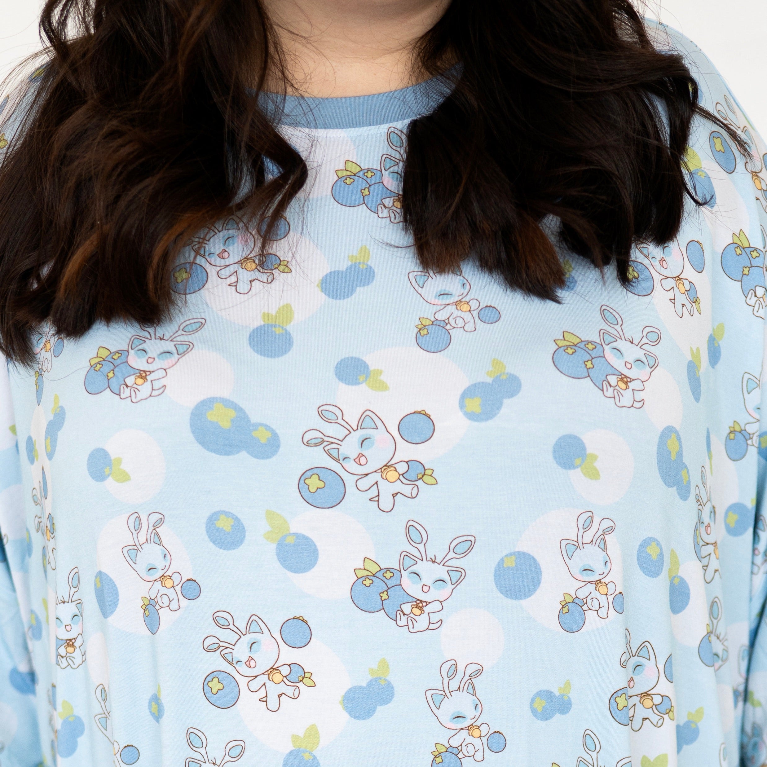 Light blue sleep tee with a repeating pattern of cute baby neopets and blueberries.