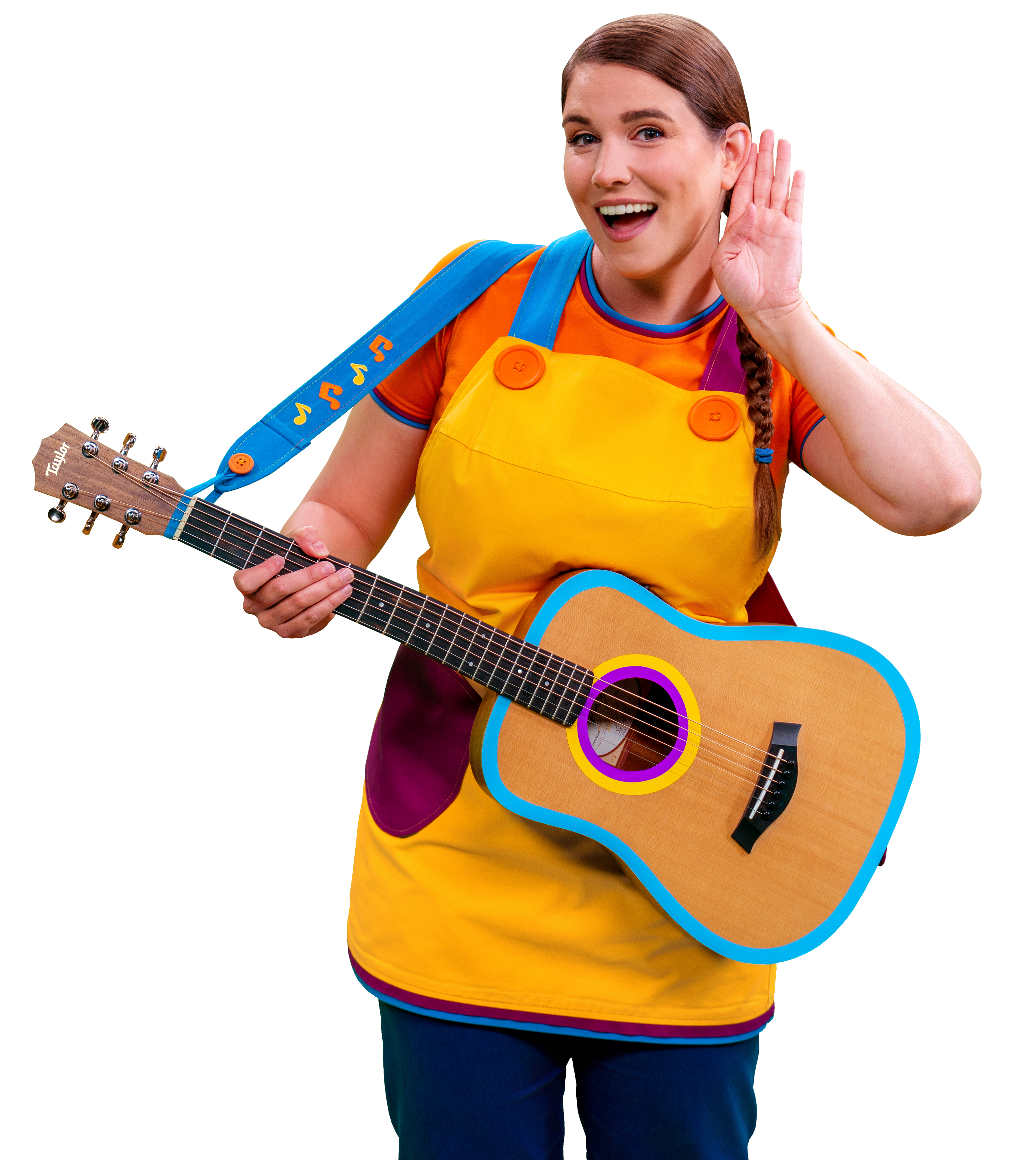 A woman in a yellow apron and orange shirt holds a guitar and cups her ear.