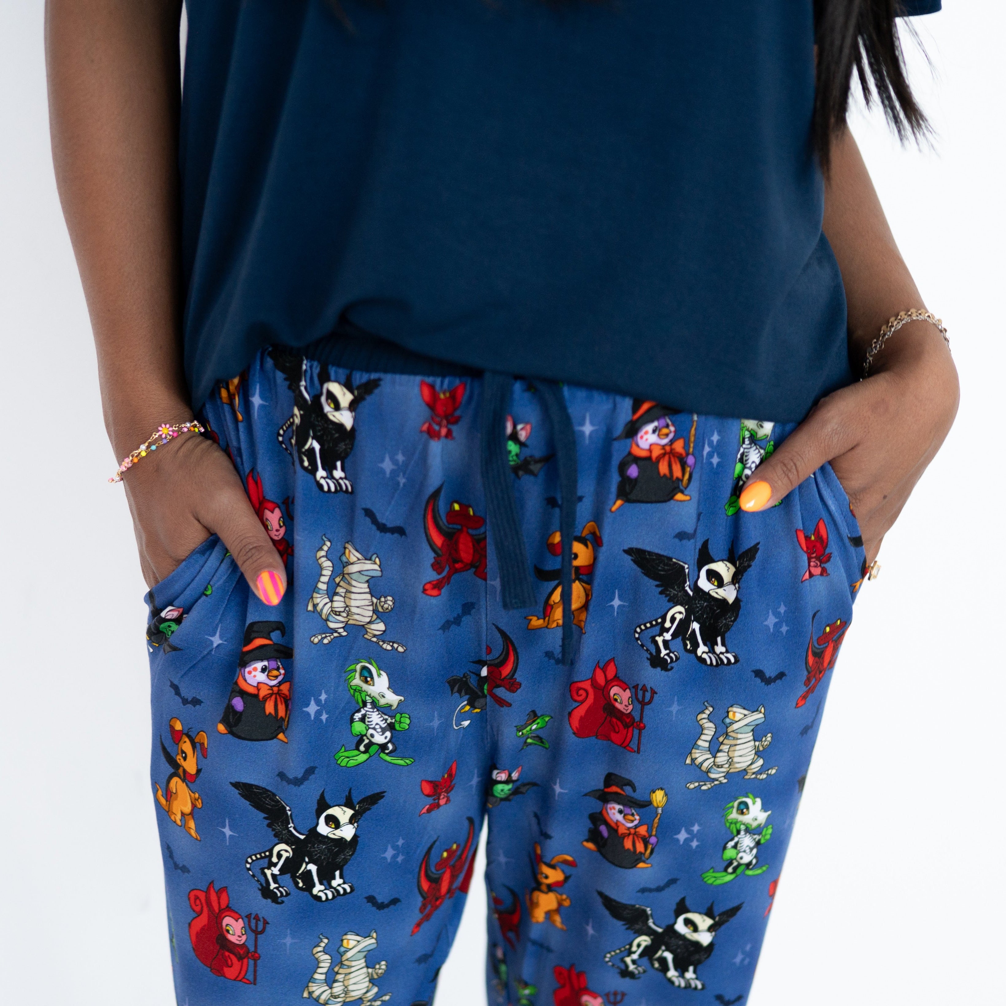 Women's blue joggers with a Halloween Neopets print.