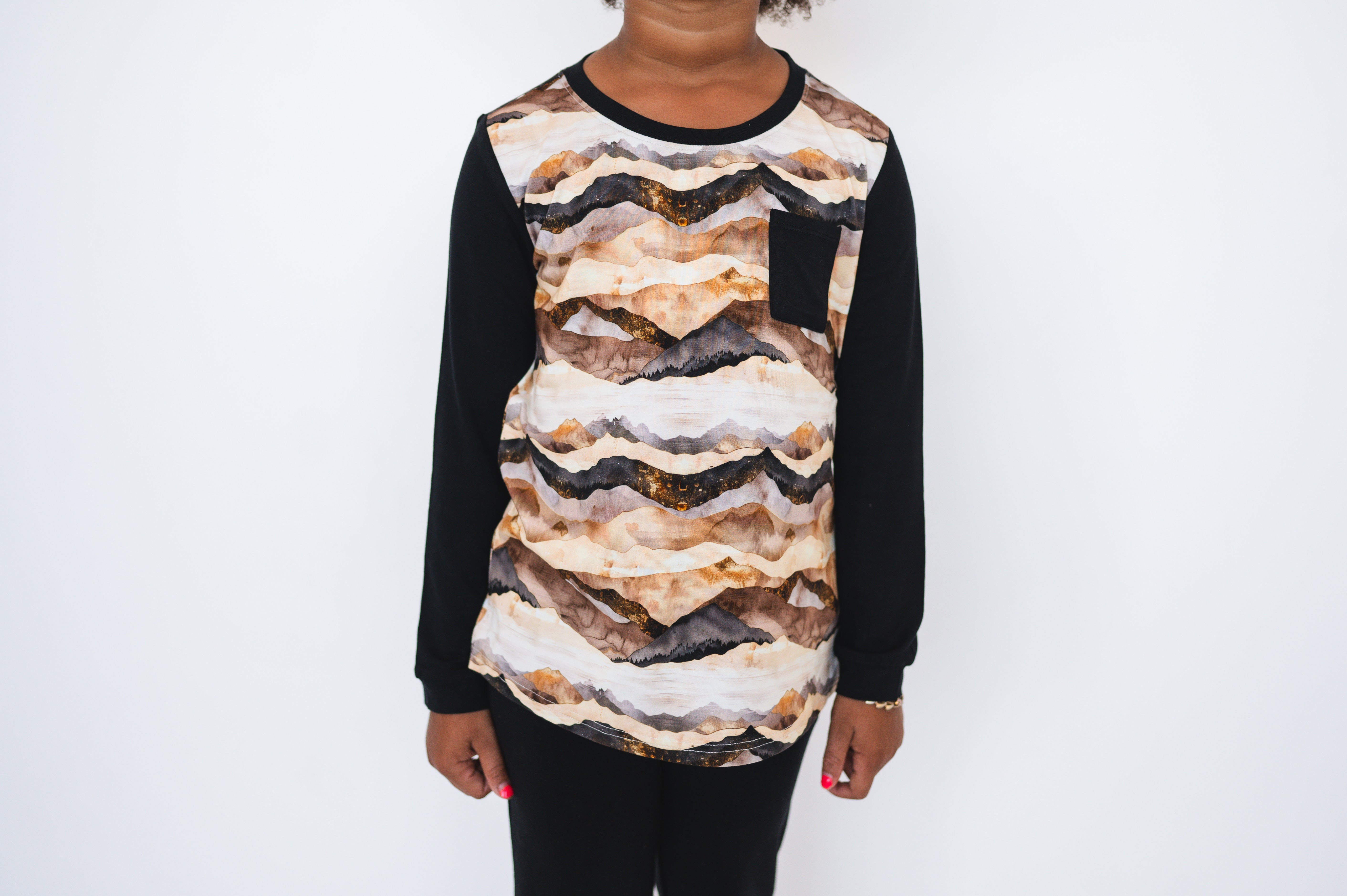 Long sleeve shirt with mountain range print and chest pocket.