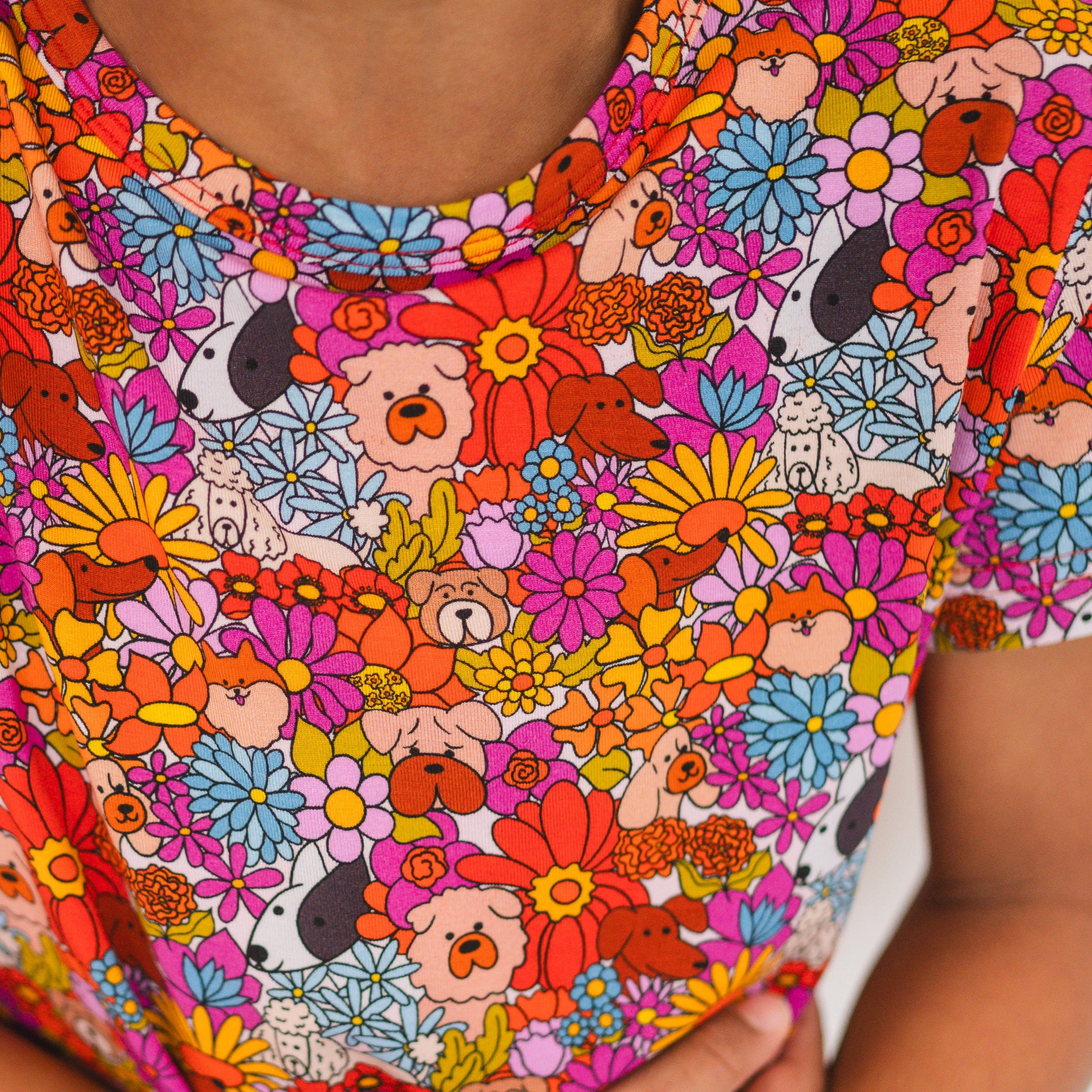 A t-shirt with a colorful floral and dog print.