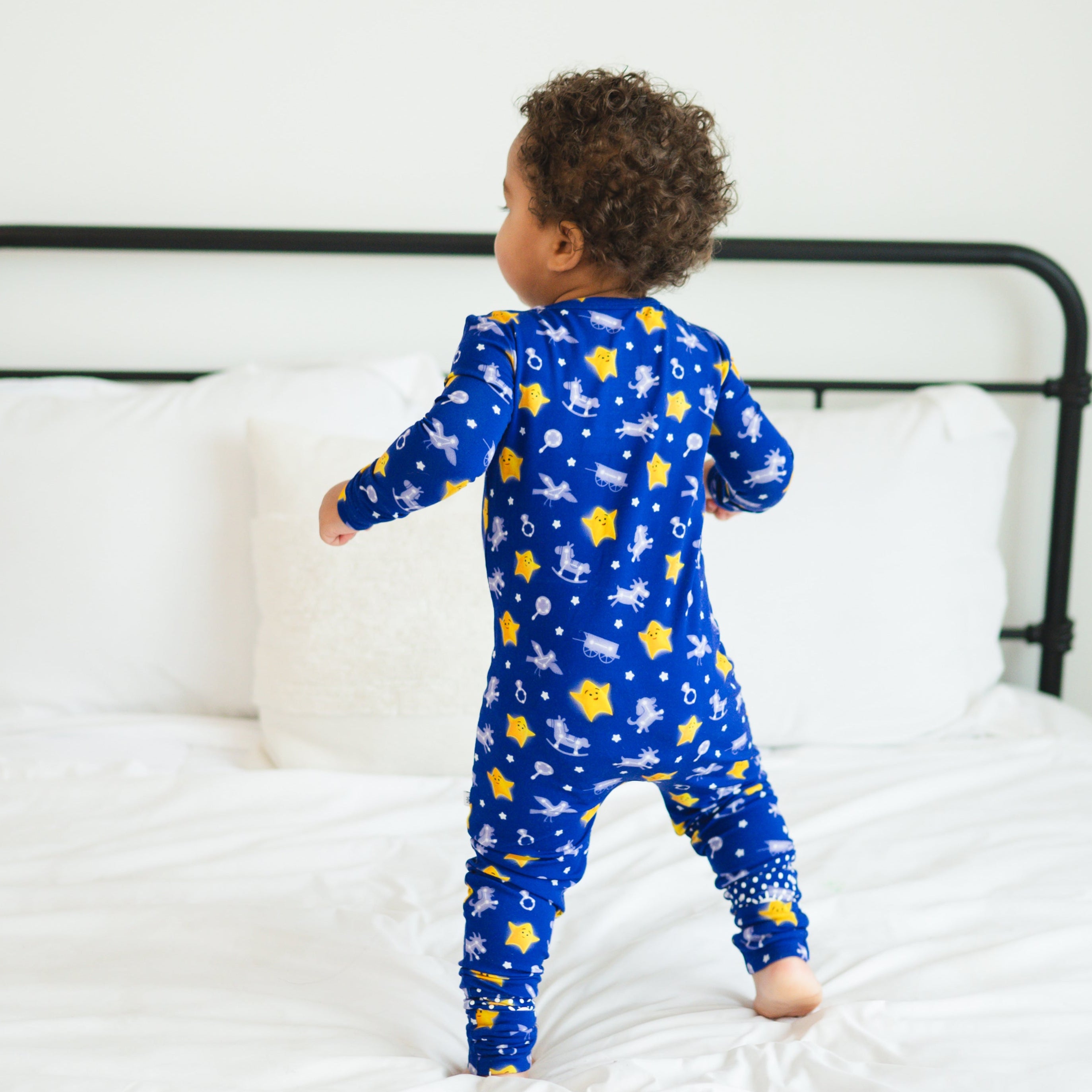 Blue bamboo pajamas with yellow stars and rocking horses.