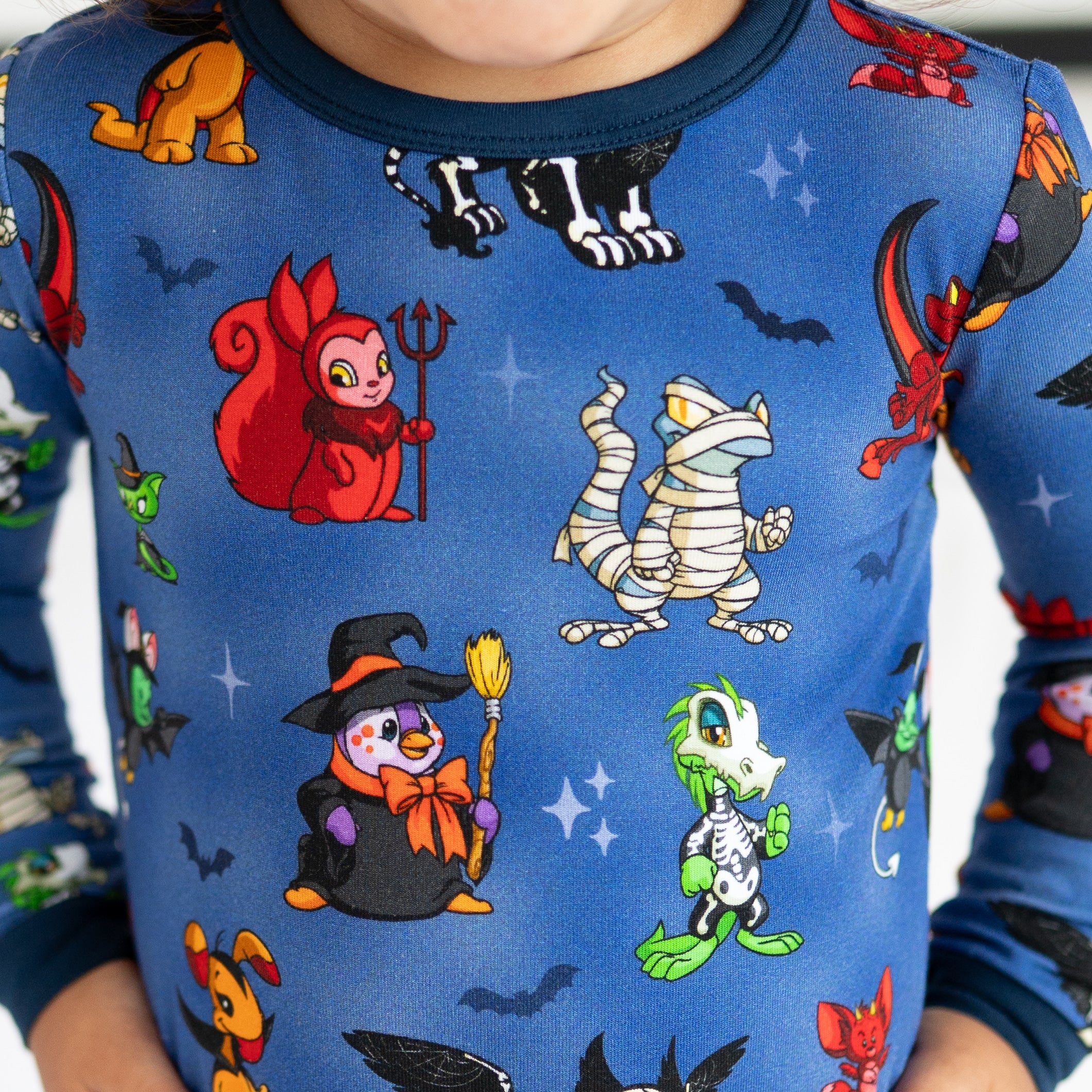 Blue long-sleeve pajamas with a Halloween Neopets print.