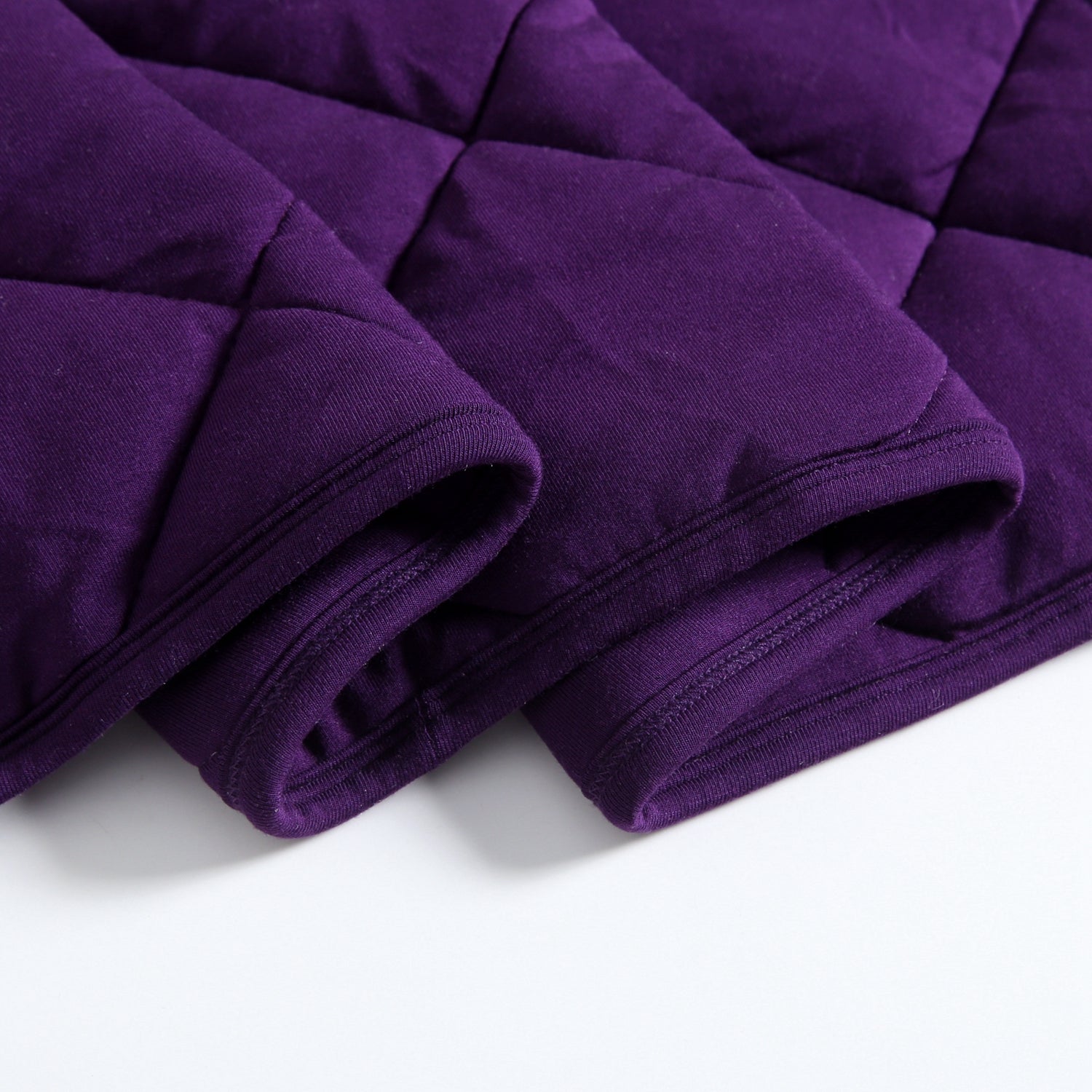 Quilted purple bamboo fabric with a ribbed hem.