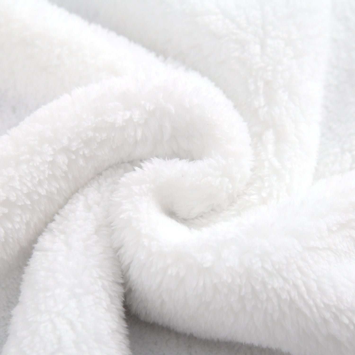 Soft white plush blanket with a textured, fluffy surface.