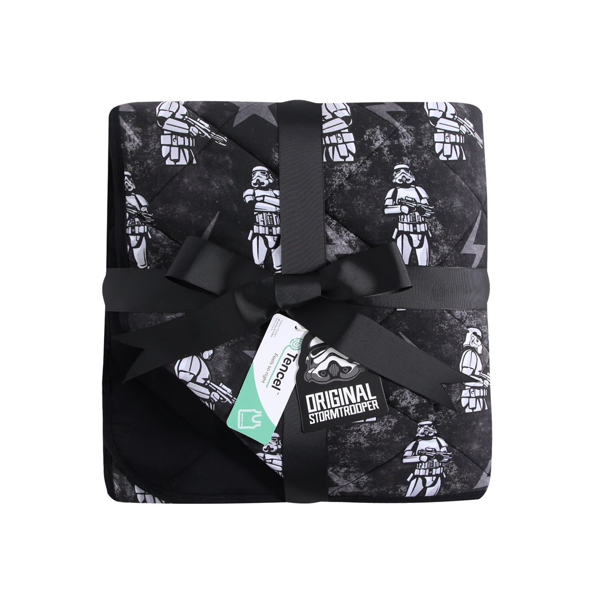 A black and gray quilted blanket with a repeating pattern of white stormtroopers, tied with a black ribbon.