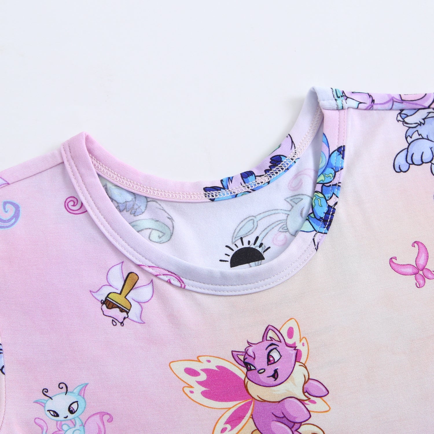 Neopets Faerie Tencel Modal dress with a pink gradient and cartoon cat print.