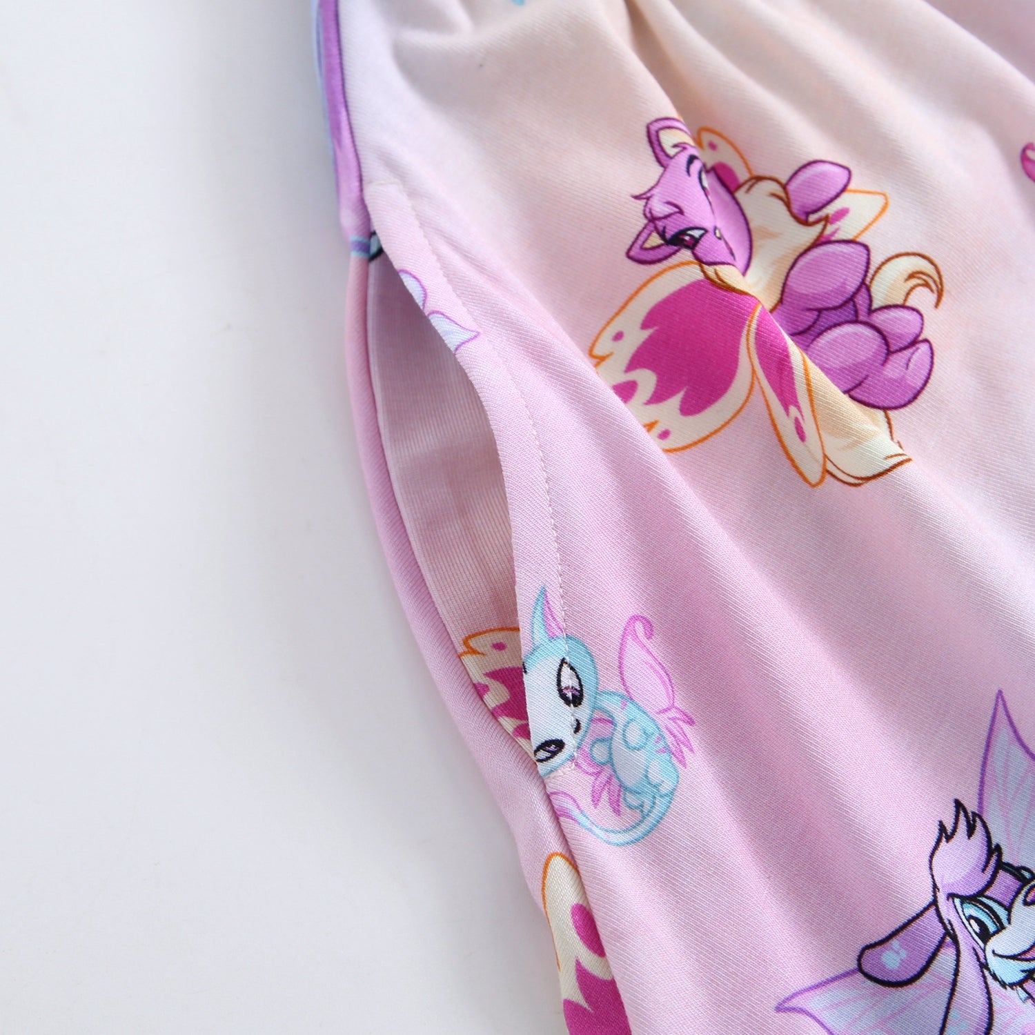 Pink Tencel modal dress with Neopets Faerie print and a pocket.