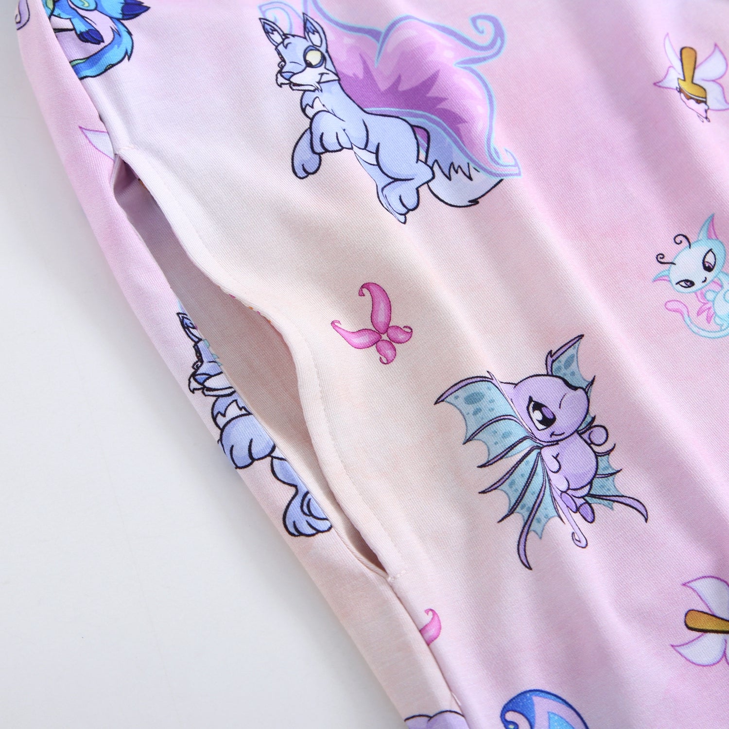 Pink Tencel modal sleep tee with Neopets Faerie print and a side pocket.