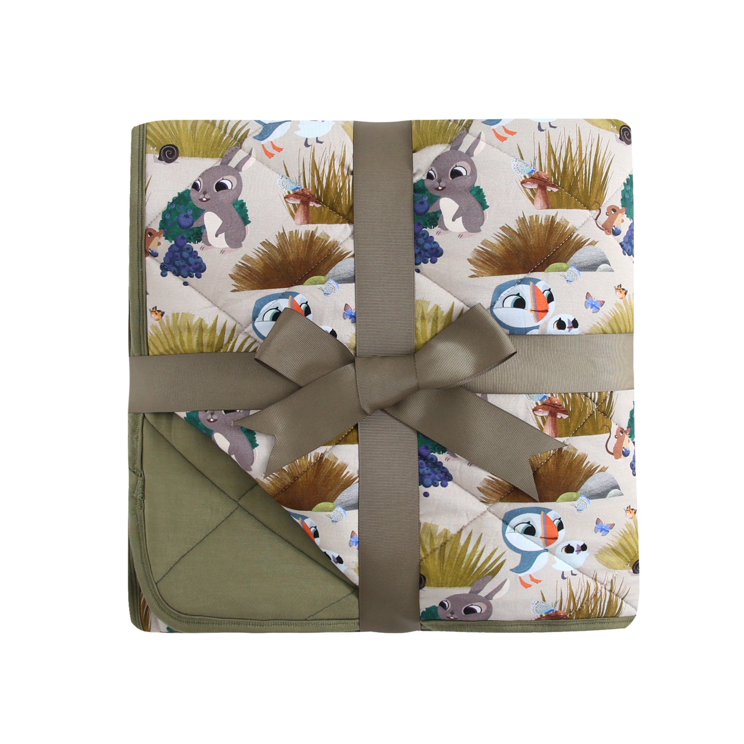 A quilted blanket with a Puffin Rock™ print, tied with a ribbon.