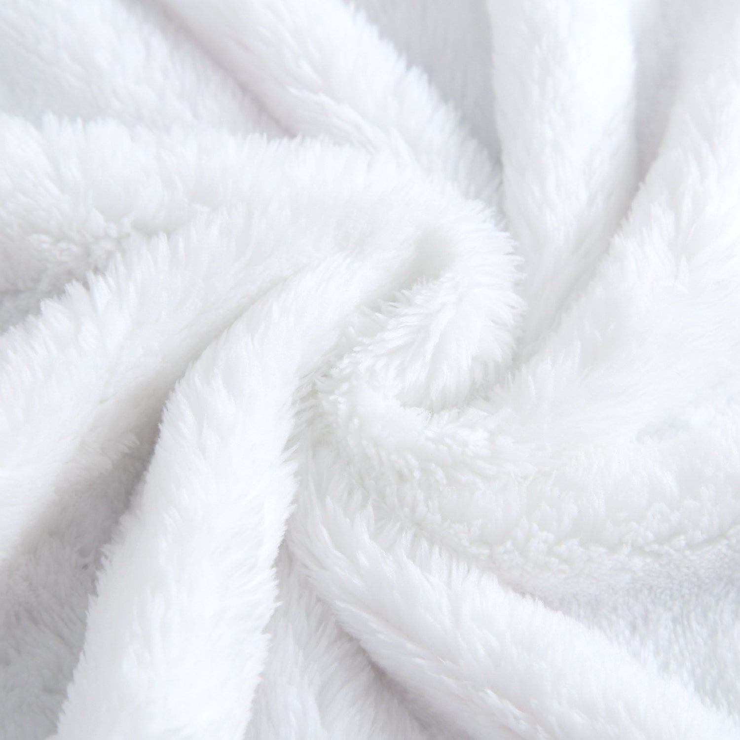 A white plush blanket with soft folds and textures.