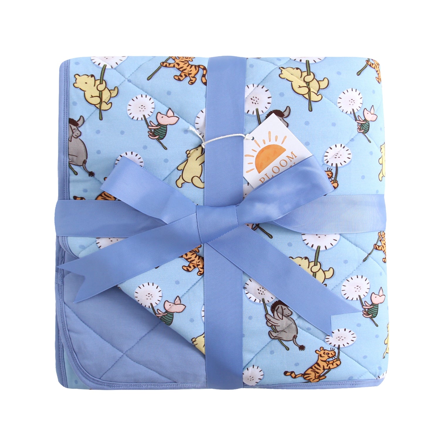A light blue quilted blanket with a Winnie the Pooh character print, tied with a blue ribbon.