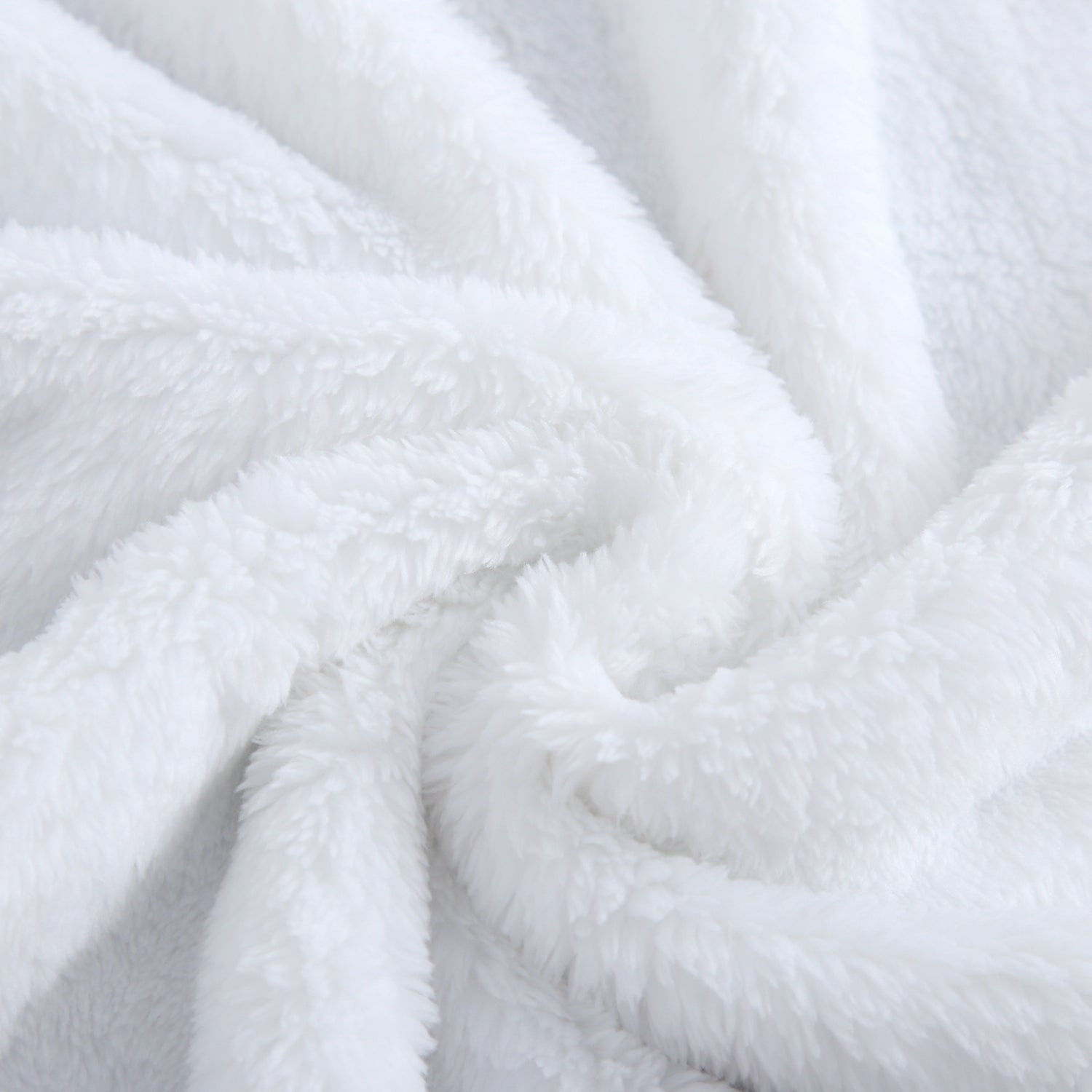 A white plush blanket with soft folds and textures.
