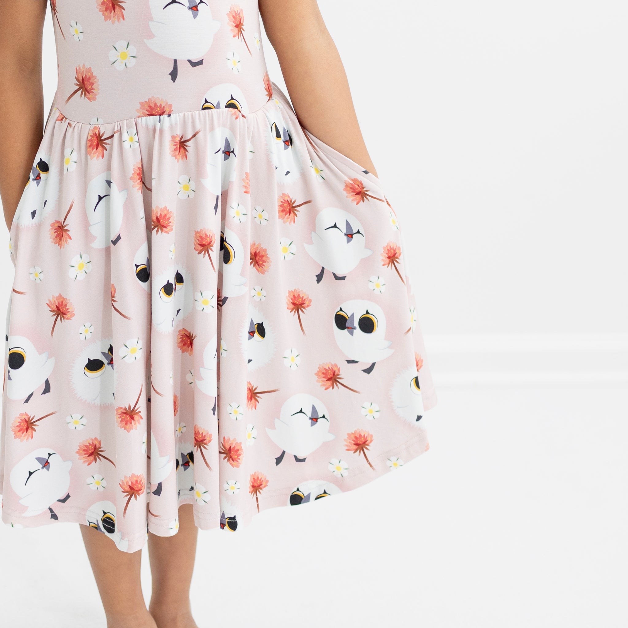 Pink Tencel Modal dress with Puffin Rock print and pockets.