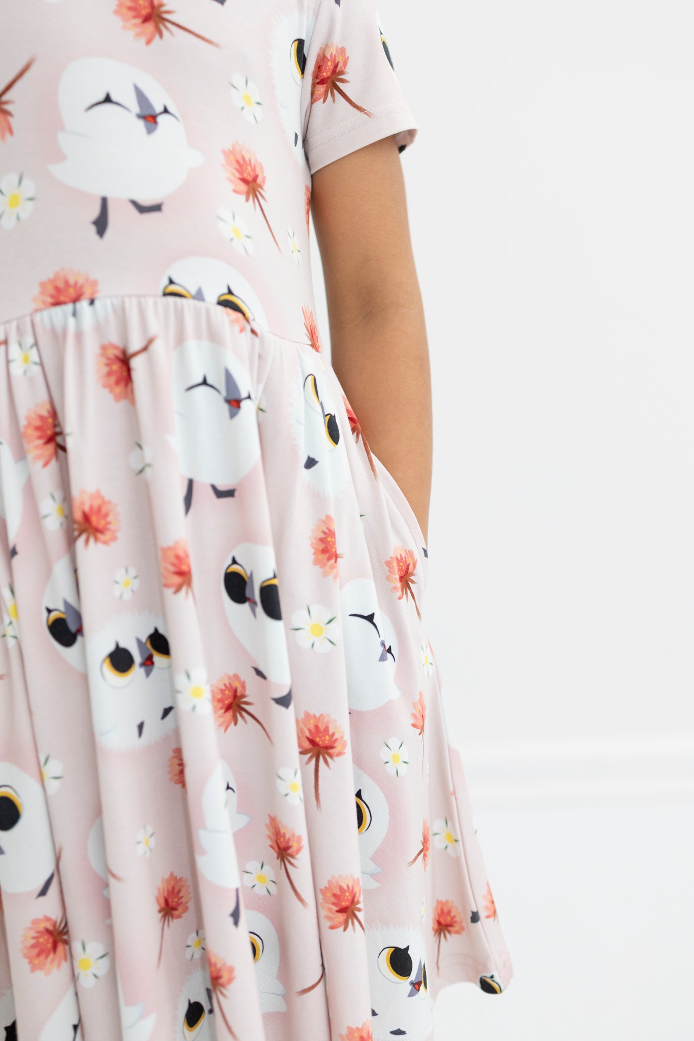 Pink Tencel Modal dress with Puffin Rock print and pockets.