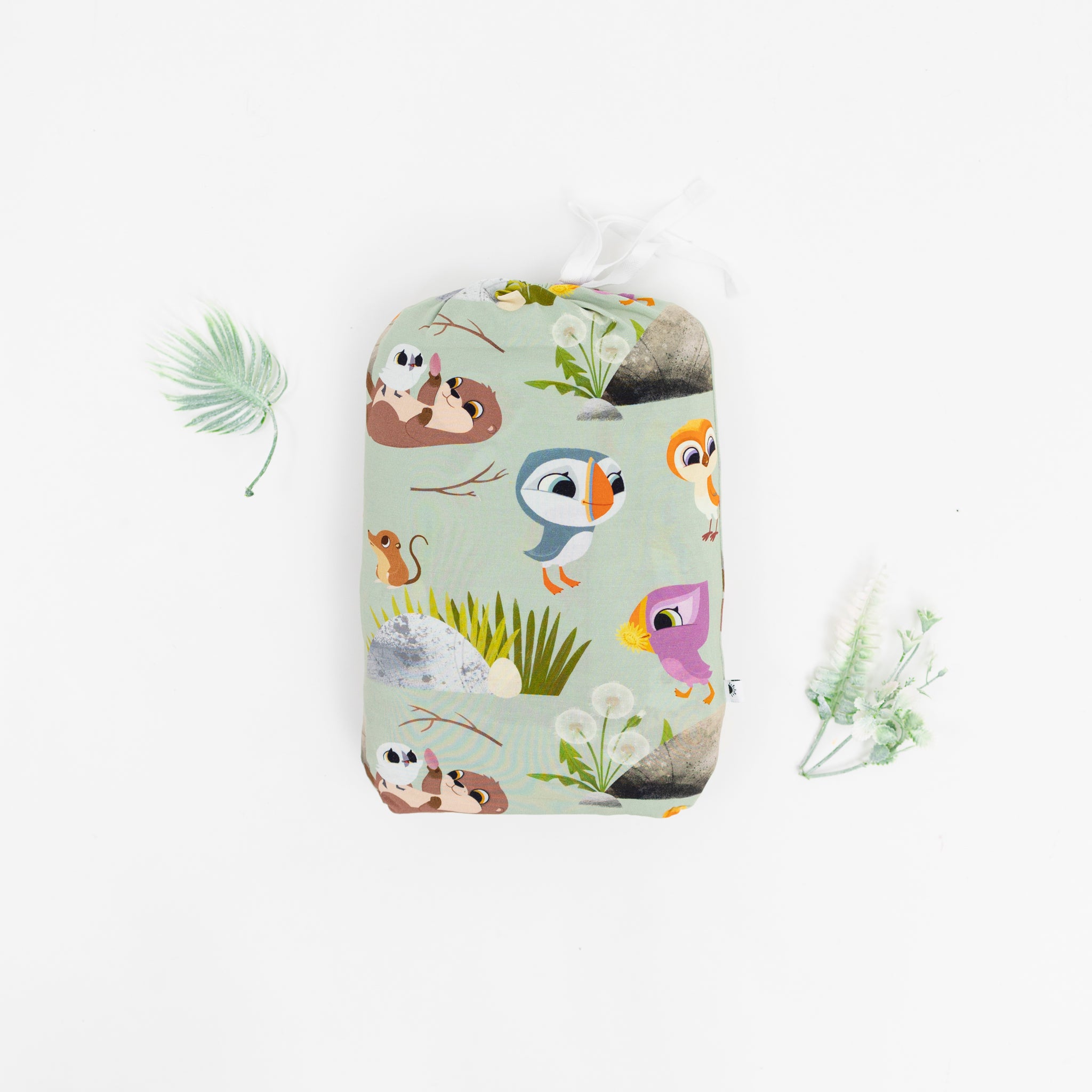 Puffin Rock™ twin sheet and pillow case set with cartoon animals on a light green background.